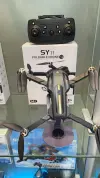 The SY11 black folding drone portable aerial photography camera features a stable brushless dual camera Application Scenario